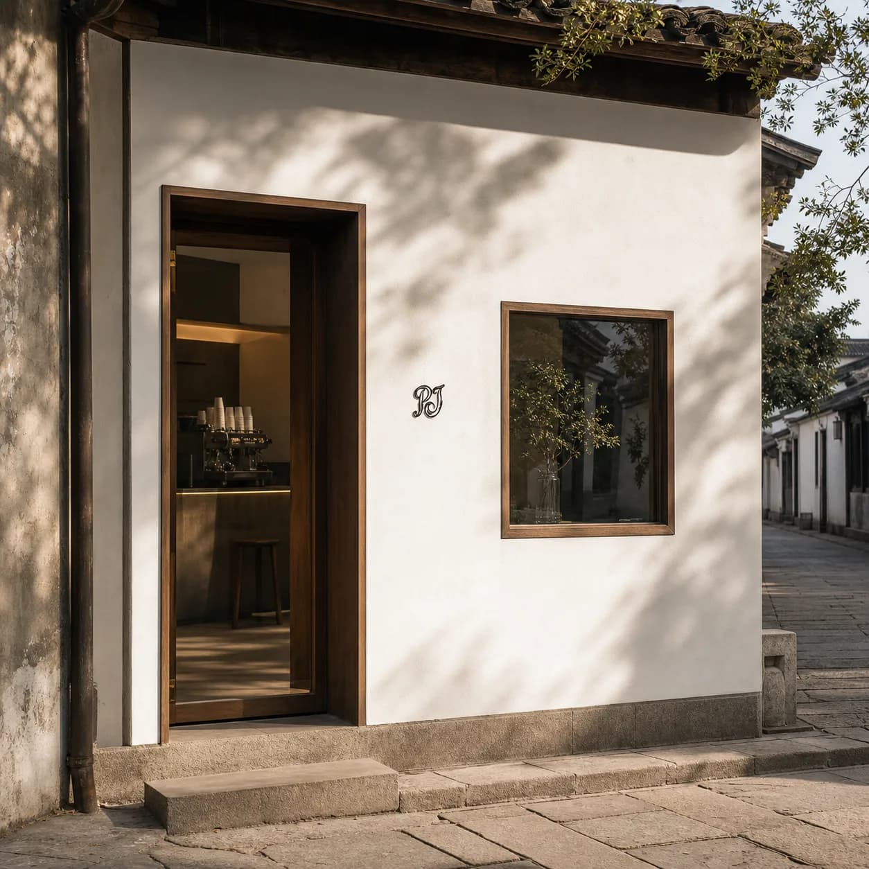 facade — white plaster, walnut door